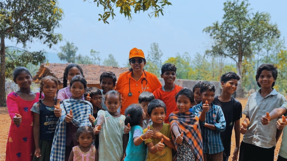 Volunteers helping children